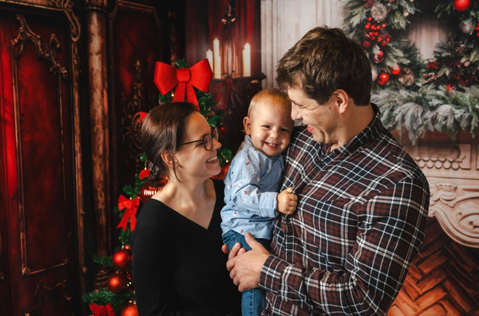 A family posing for a christmas photo.