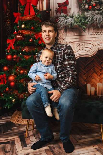 A family posing for a christmas photo.